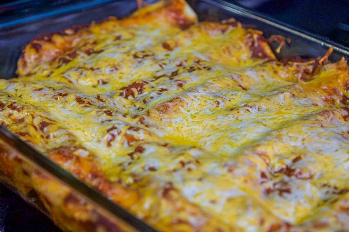 pulled pork enchiladas in a pan