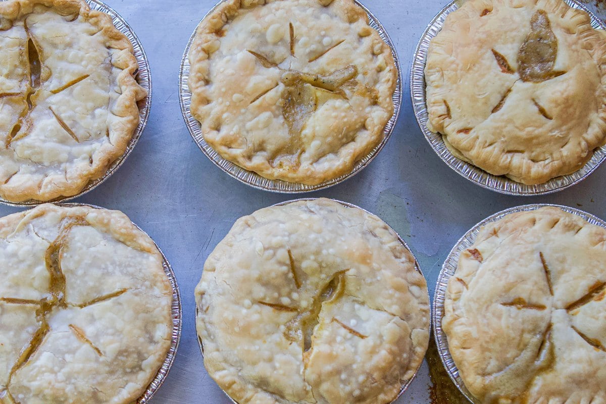 6 mini turkey pot pies on a cookie sheet