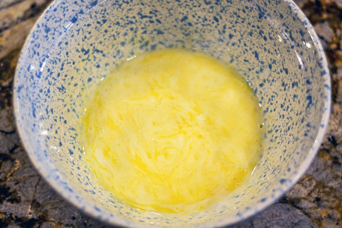 melted butter in a dotted blue bowl