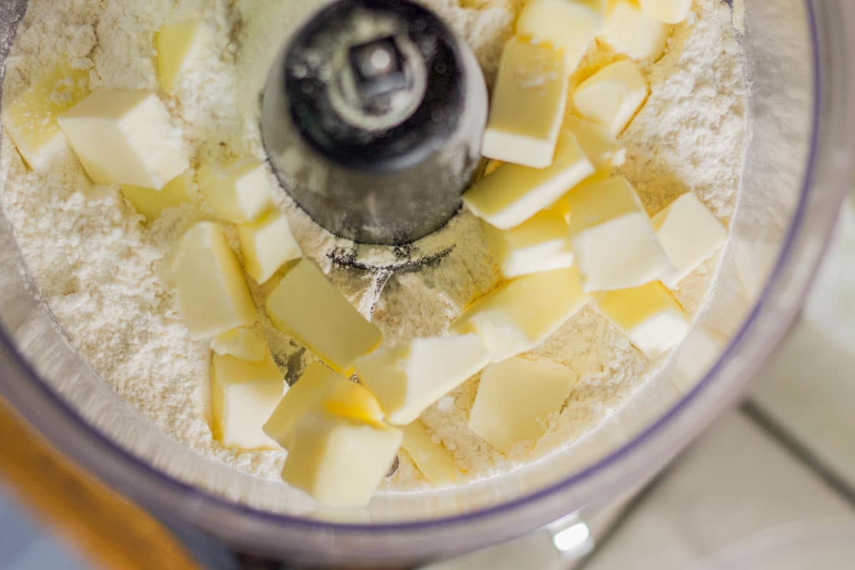 cubed butter and flour in a food processor