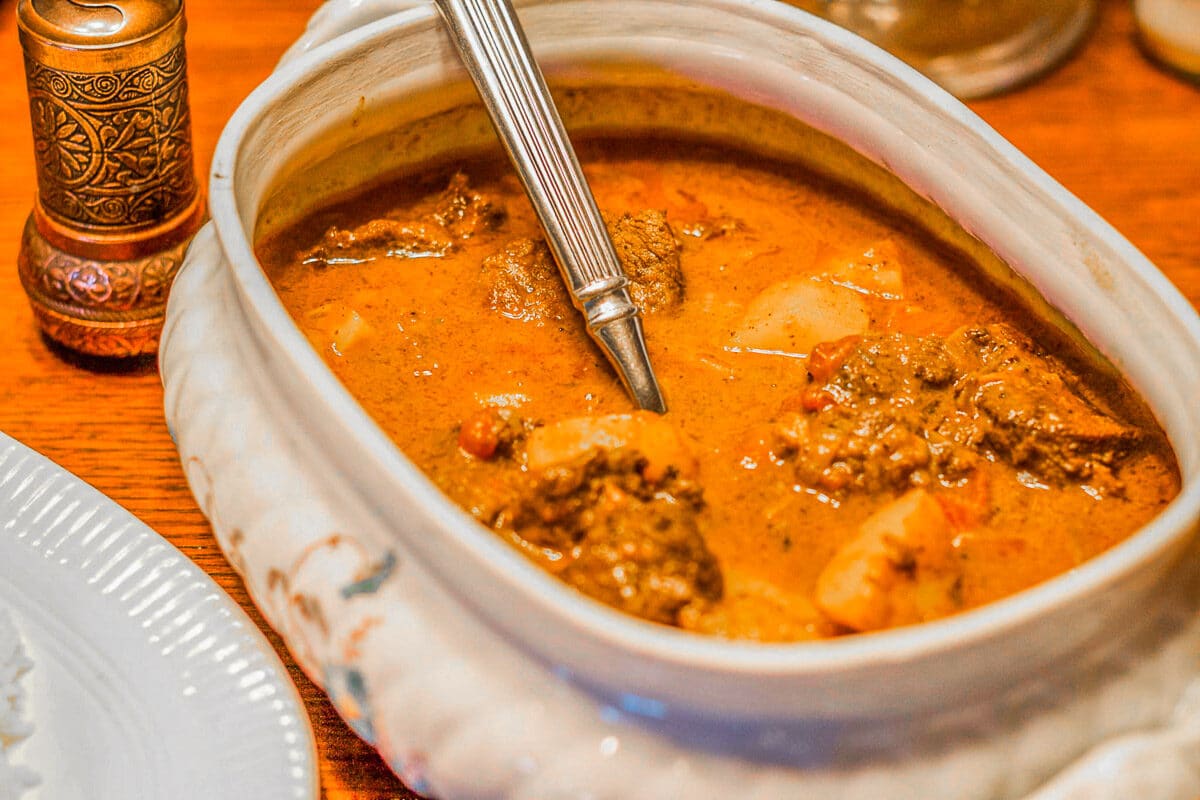 goat curry stew in a serving dish