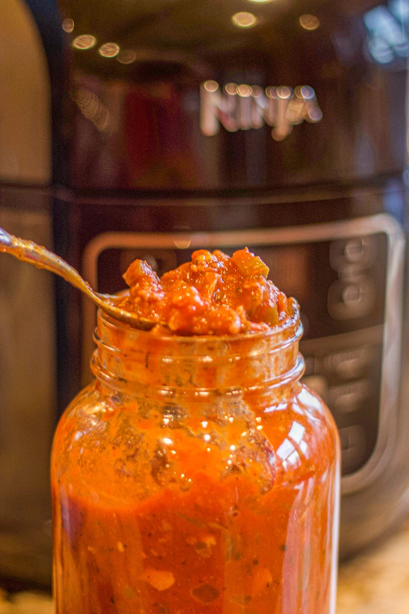 spaghetti sauce in a jar with instant pot in the background