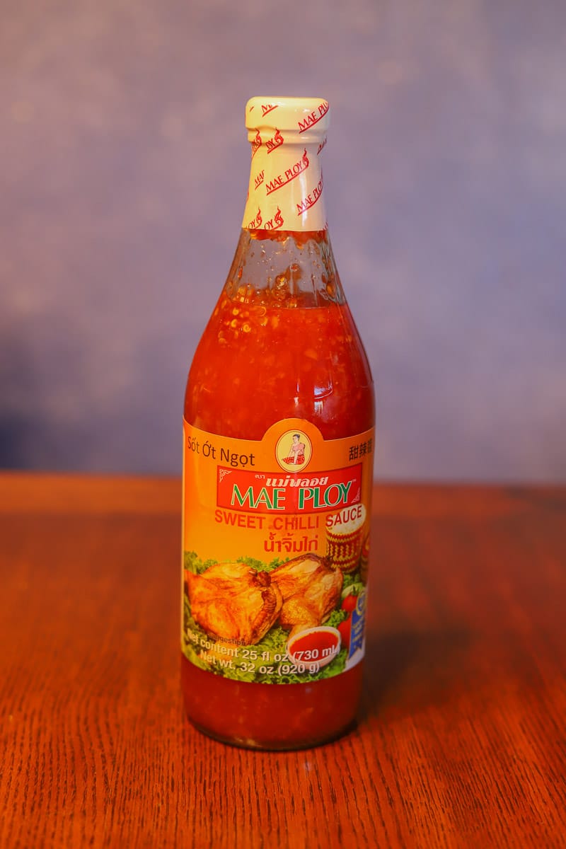 chili sauce in a bottle on the table