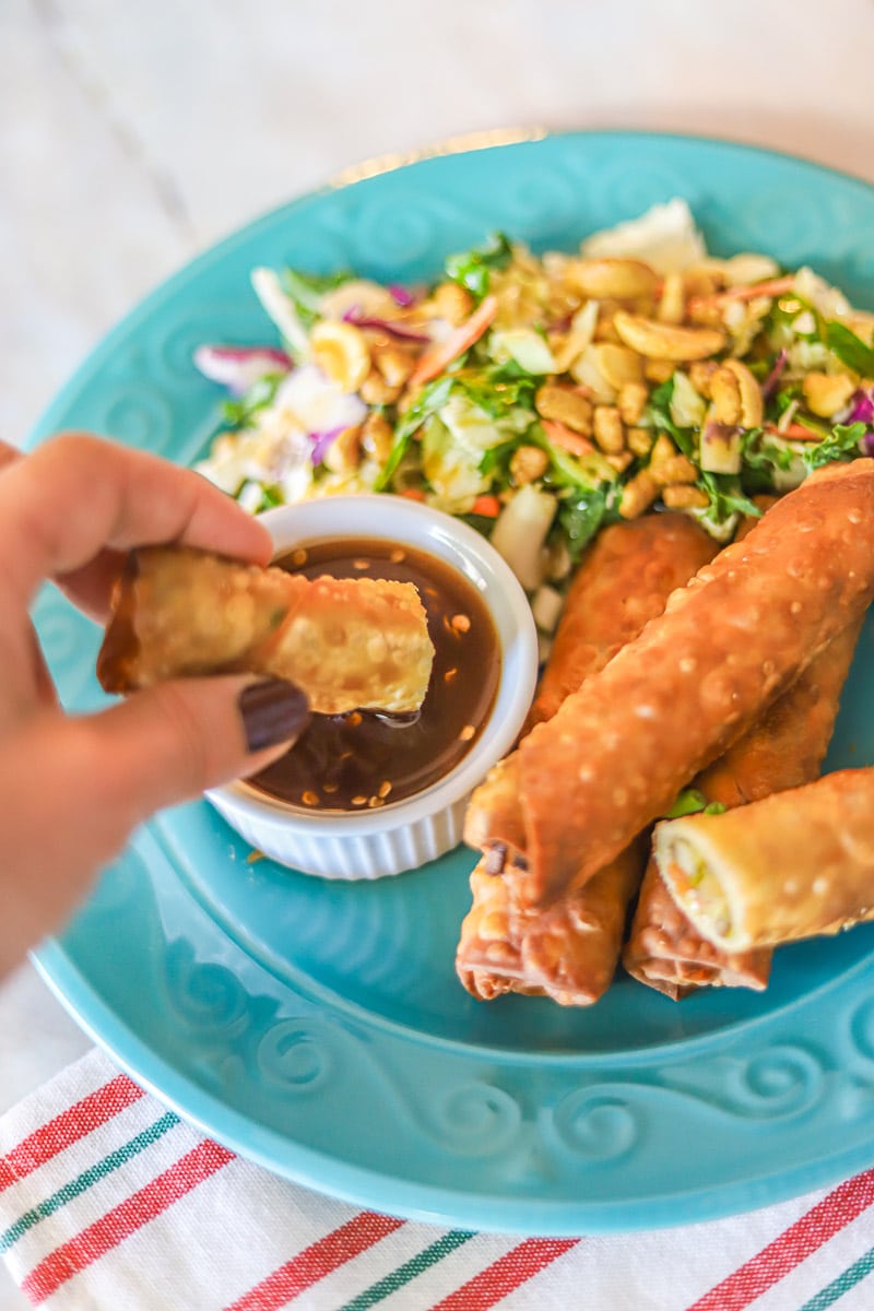 dipping lumpia in chili sauce