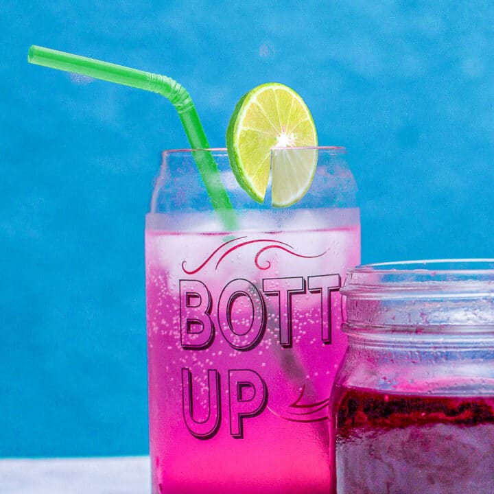 prickly pear juice in a glass with a slice of lime