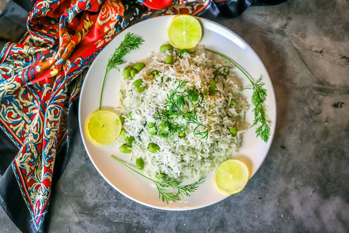 persian rice in a white plate with a scarf on the side
