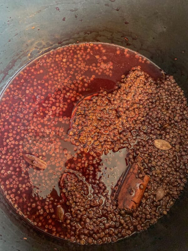 simmering elderberries in a pot