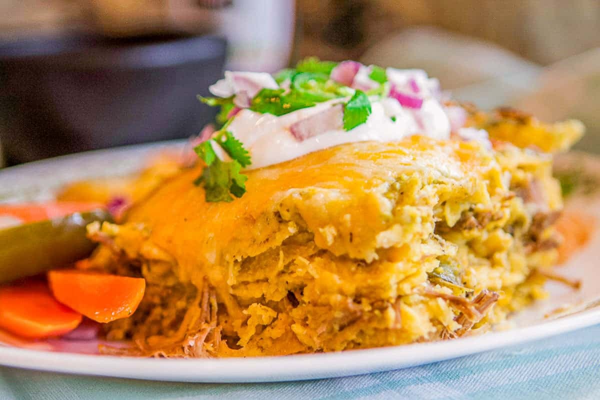 green enchiladas on a plate.