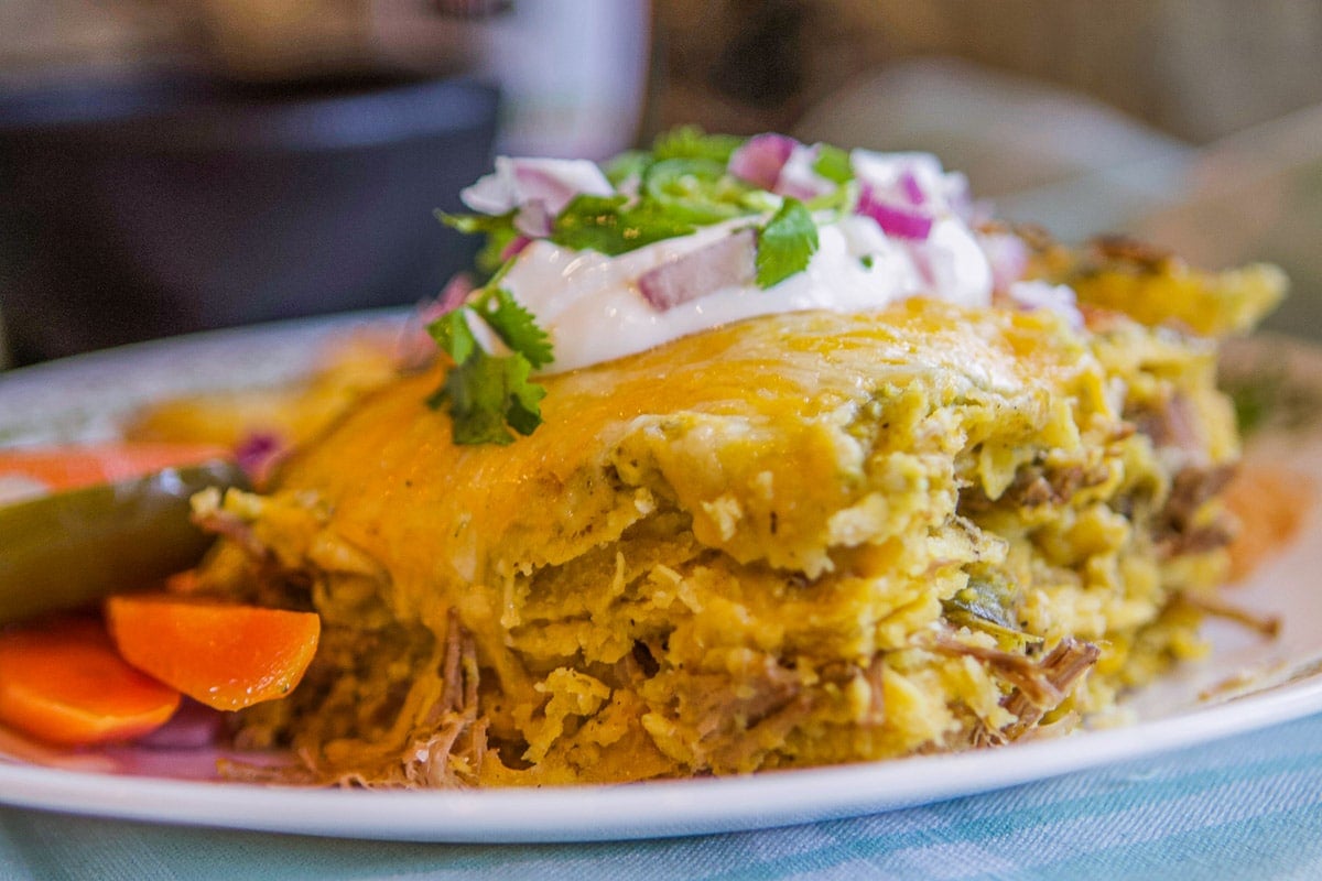 green enchiladas on a plate