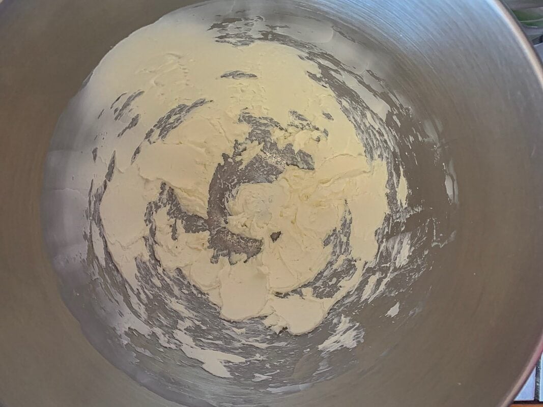creamed cream cheese in a mixing bowl
