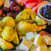 platter with Pickled Brussel Sprouts, jam, cheese, and olives
