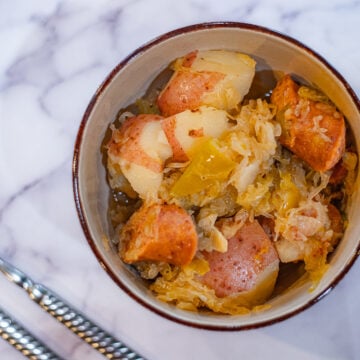 kielbasa and sauerkraut in a bowl