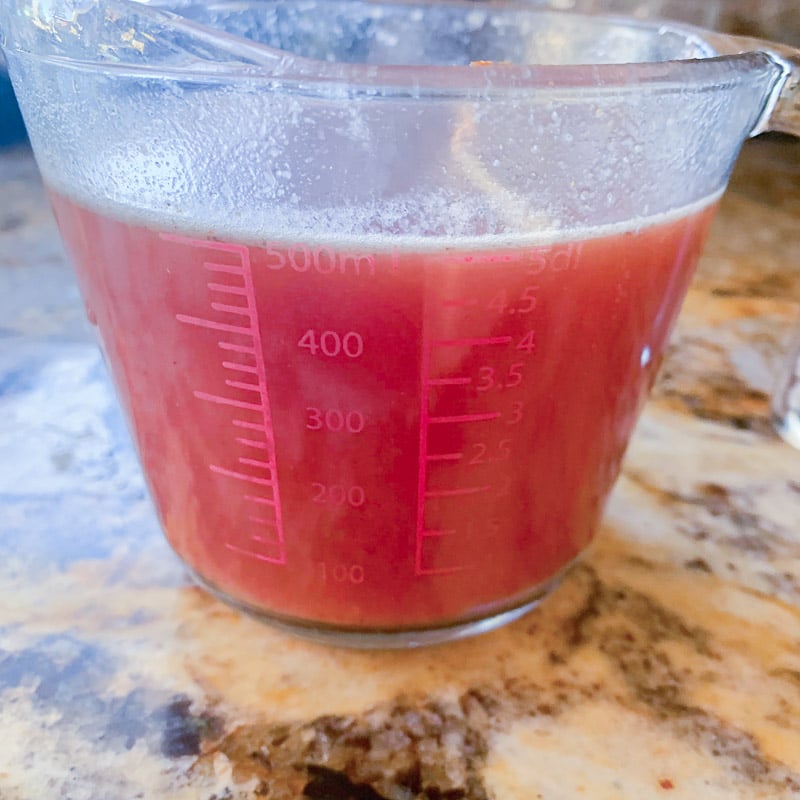 tomato sauce in a measuring cup