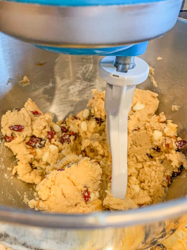 orange cardamom cookies dough being mixed in a mixer