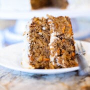 carrot cake with pineapple on a white place with a fork