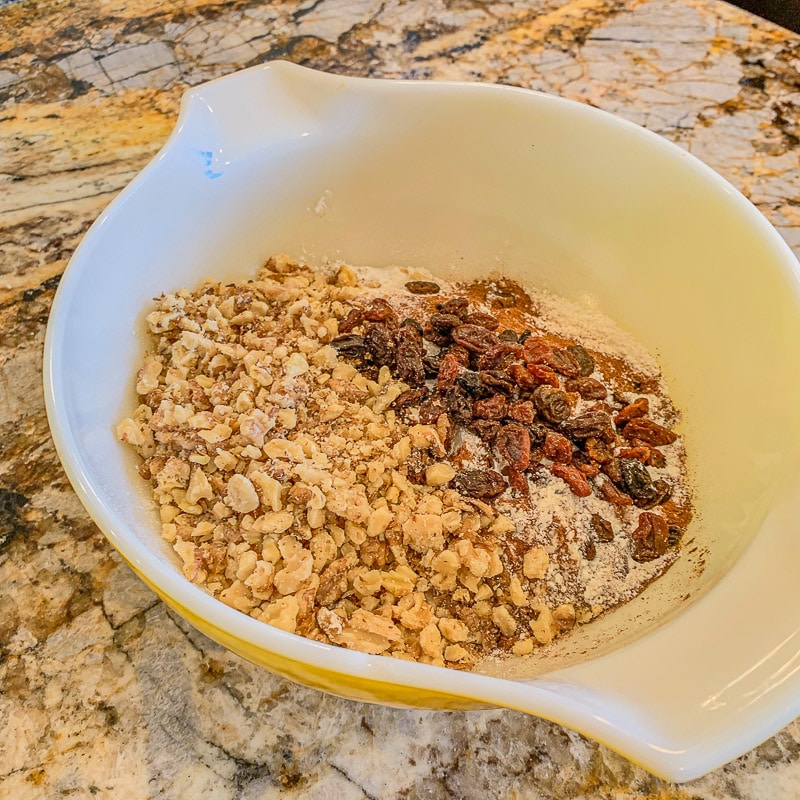walnuts and raising in a white bowl