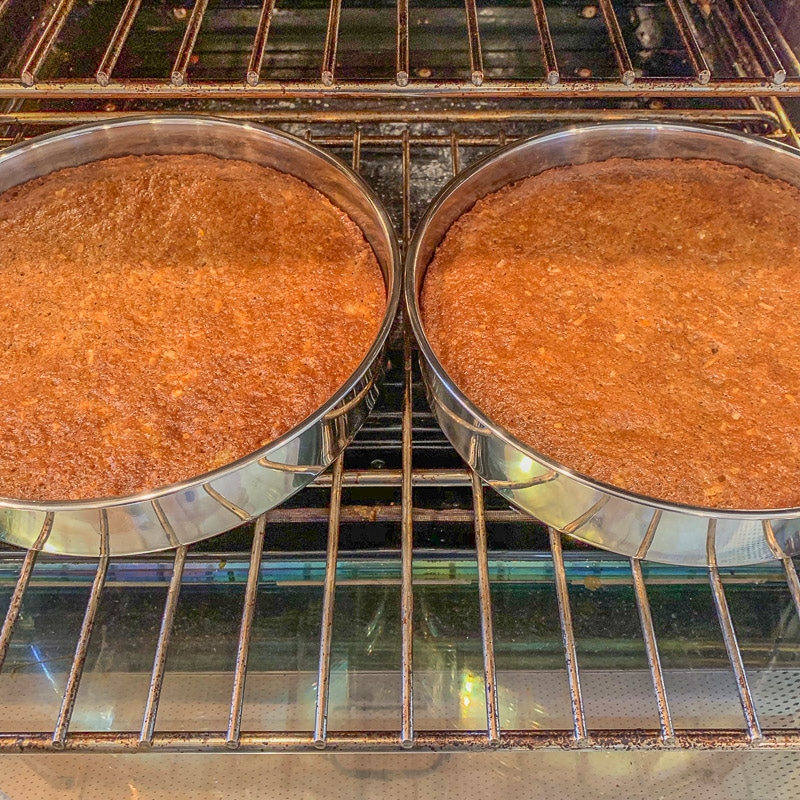 two pans of carrot cake in the oven