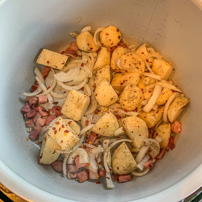  seasoned potatoes, onions, and bacon in an Instant pot