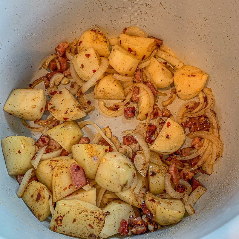 seasoned potatoes, onions, and bacon.