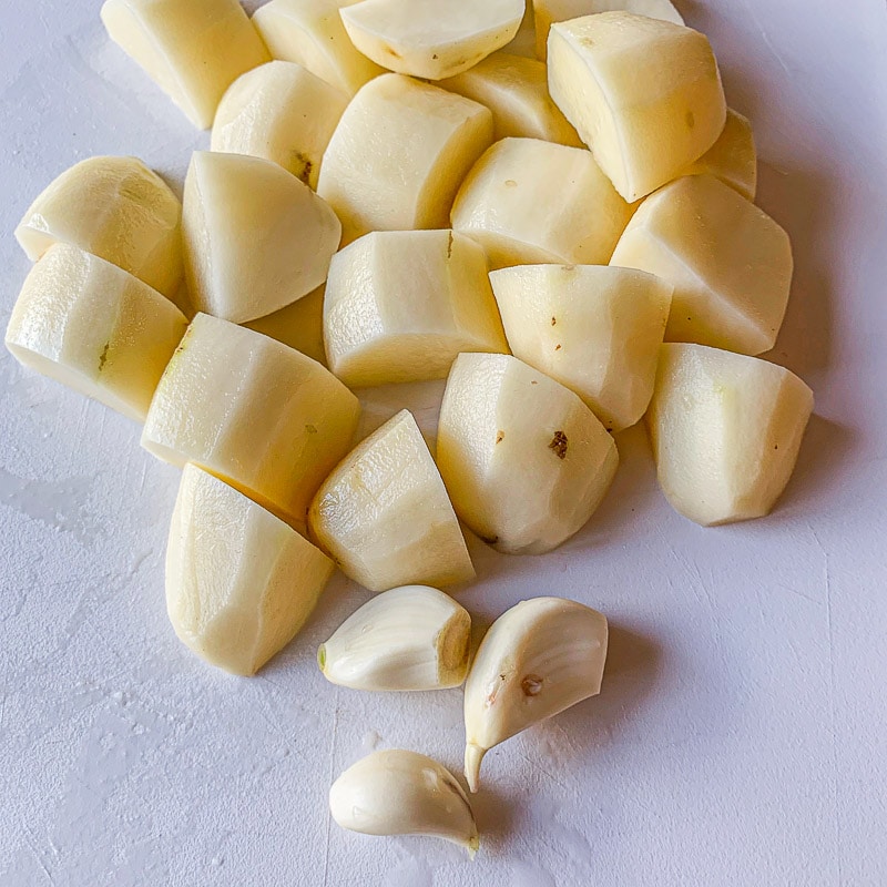 chopped potatoes and 3 garlic cloves