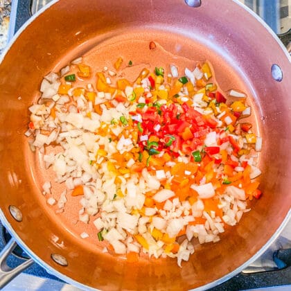 red lentil recipes: onions, peppers in a pan being sautéed