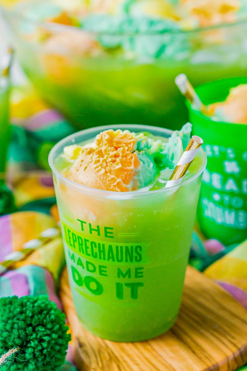 green punch in plastic cups.