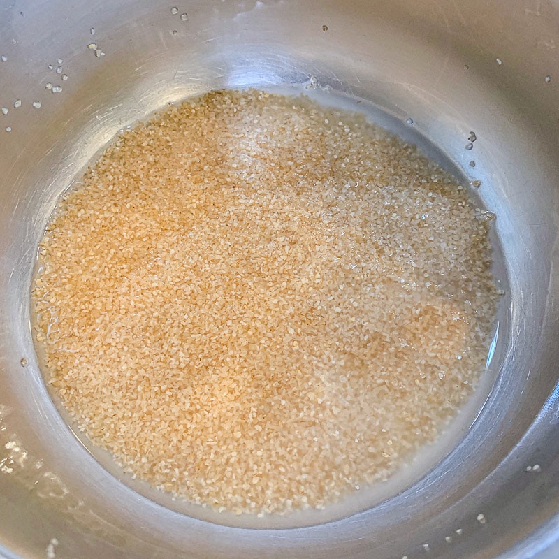 soaking bulgur in a silver bowl