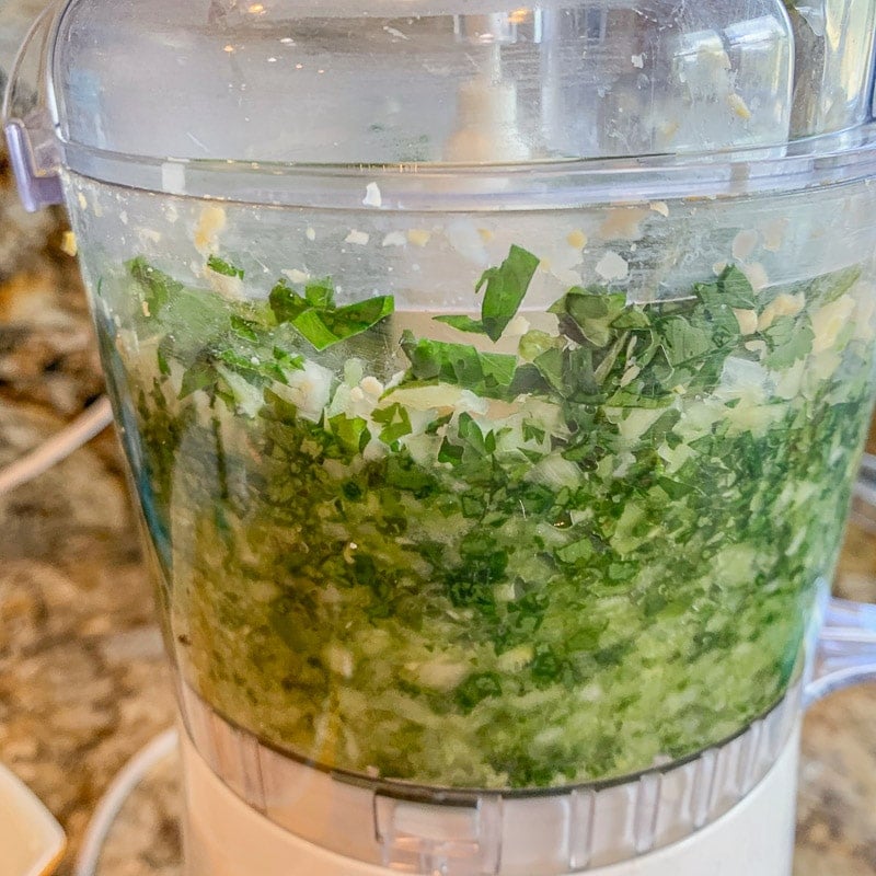 grinding herbs in a food processor
