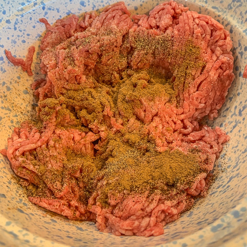 ground beef and spices in a bowl