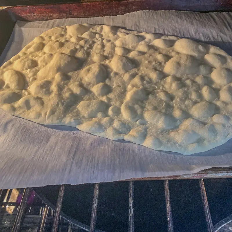 lavash bread in the oven on parchment