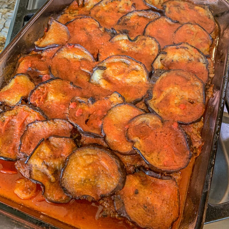 uncooked eggplant casserole in a casserole dish