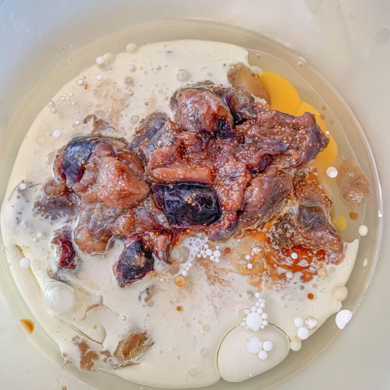 milk, oil, and figs in a bowl
