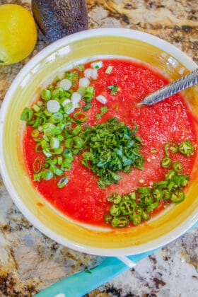 yellow bowl with red salsa ingredients