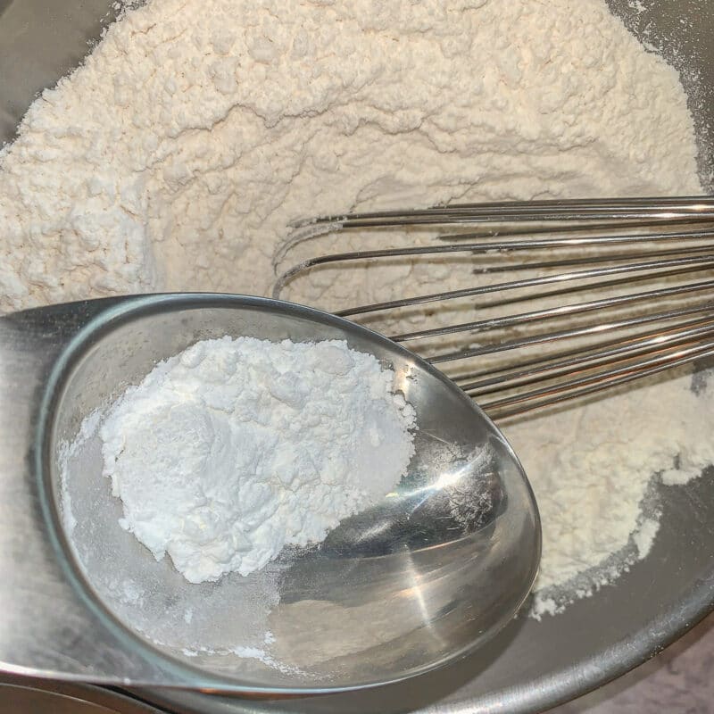 flour and baking powder whisked in a bowl