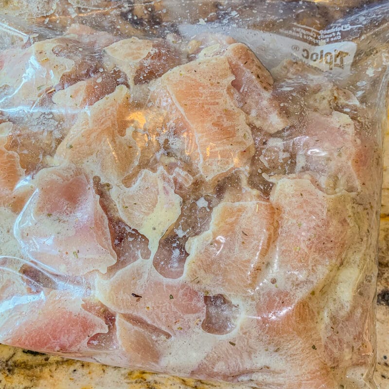 marinated chopped chicken in a ziplock bag