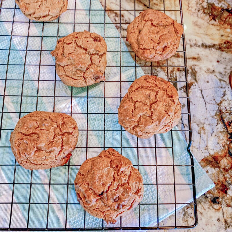 chickpea cookies on a cookie sheet over a blue and white kitchen towel