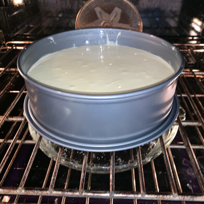 unbaked cheesecake in the oven