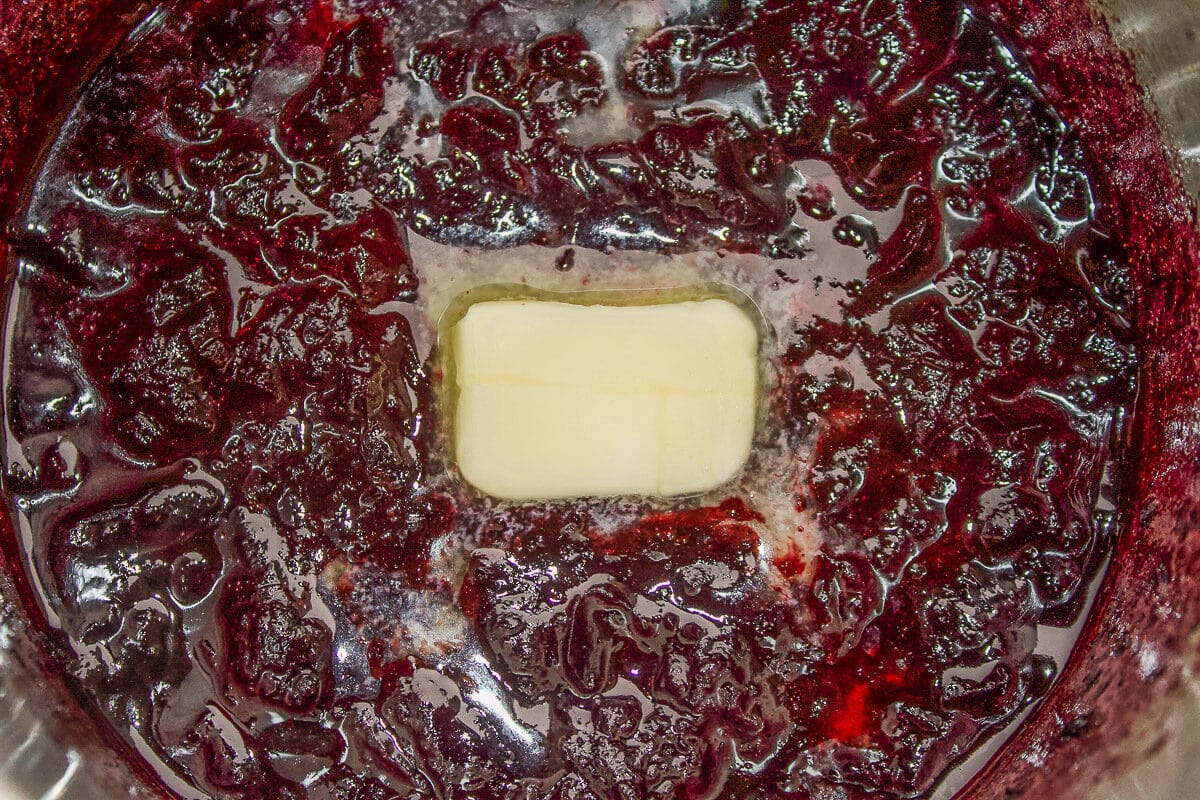 a pat of butter melting in reduction sauce