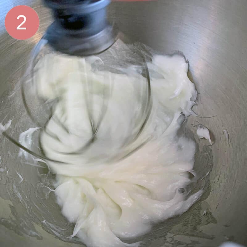 lard being whipped in a silver mixer bowl