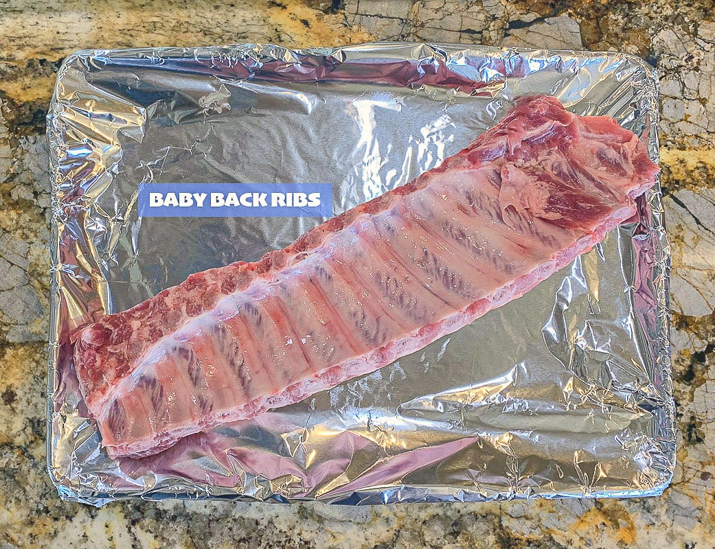 baby back ribs on a foil lined pan