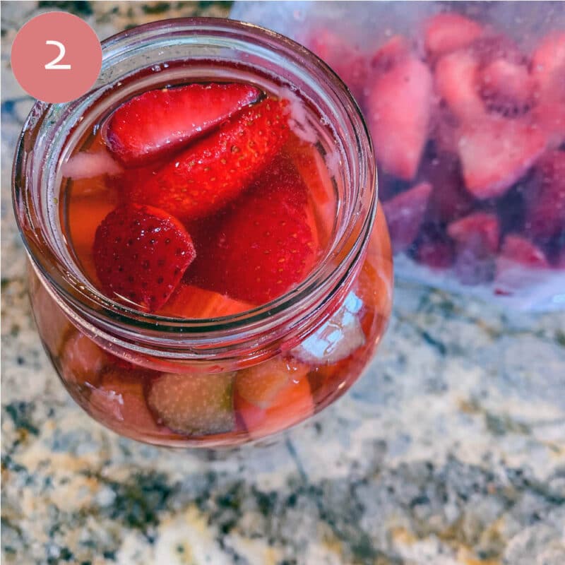 Strawberries in a mason jar with alcohol