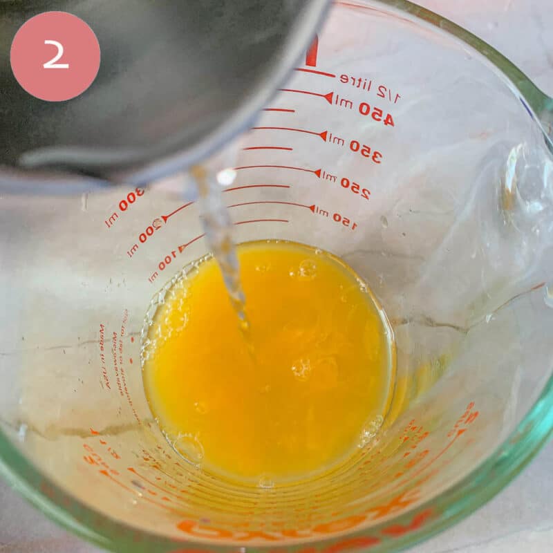 pouring liquid into a measuring cup