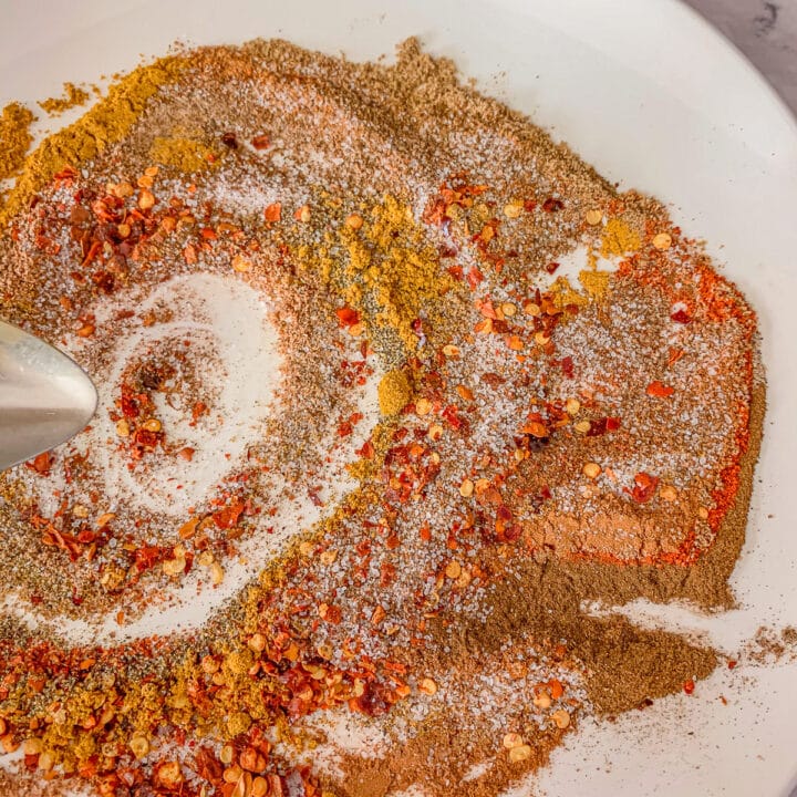 a white plate with spices on it.