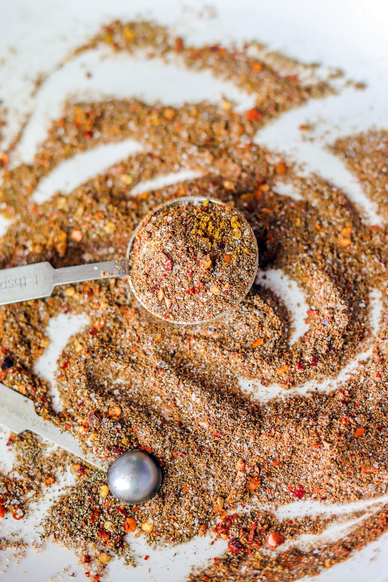 shawarma spice blend in a measuring spoon over more spice in a plate