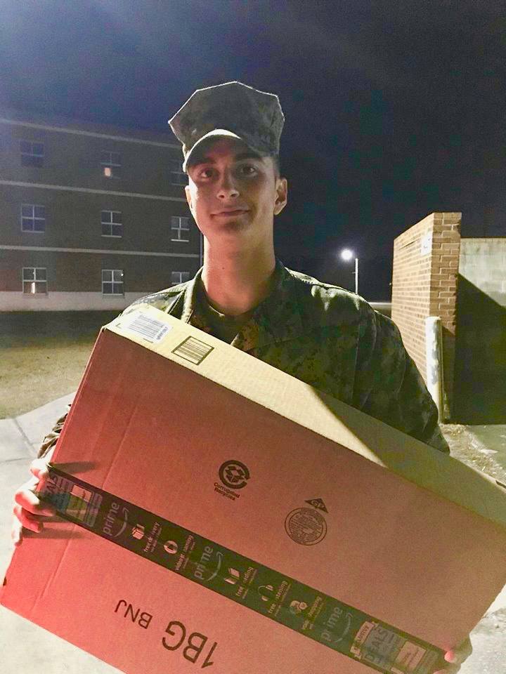 marine holding a box