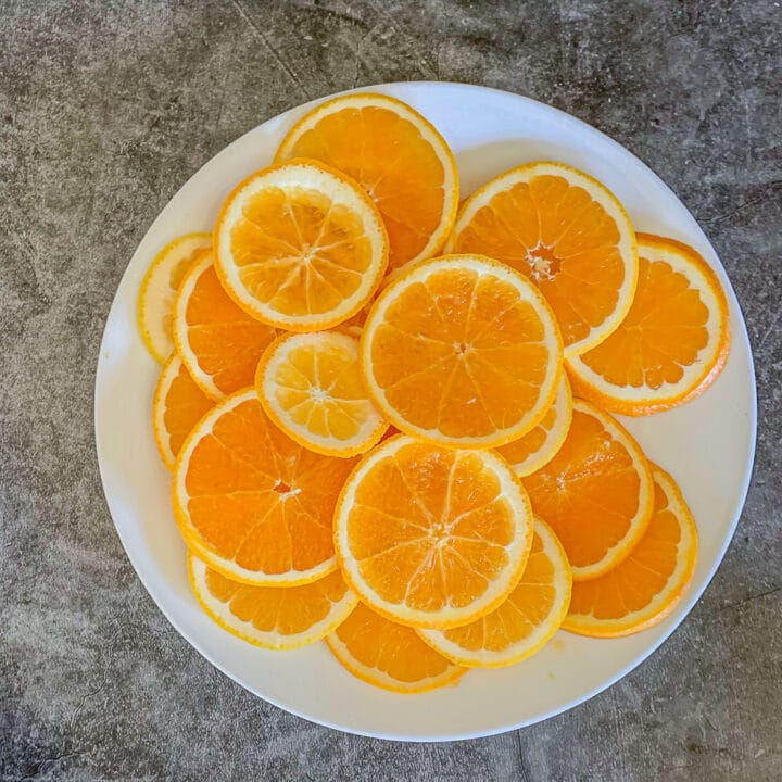 sliced oranges on a white plate