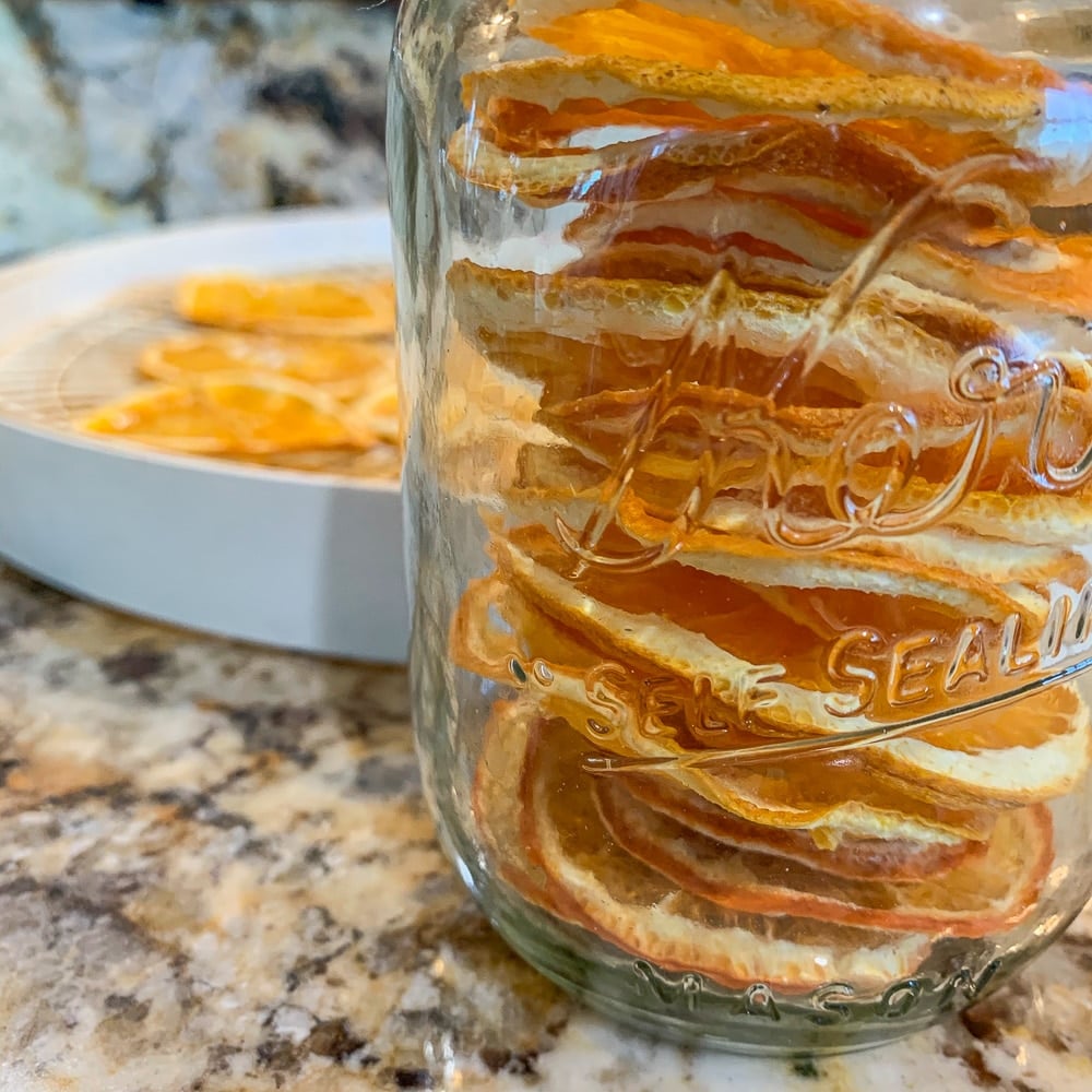 dehydrated oranges in a mason jar