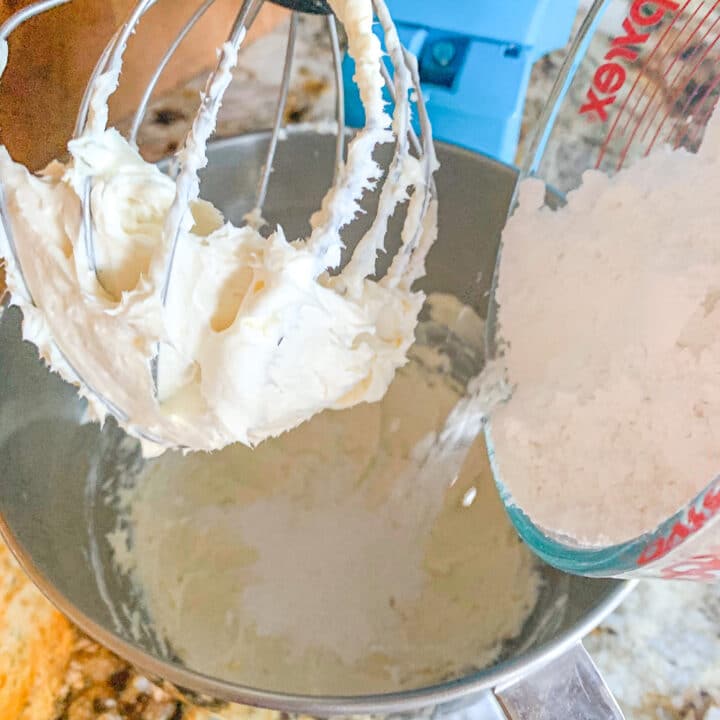 adding powdered sugar to cream cheese frosting
