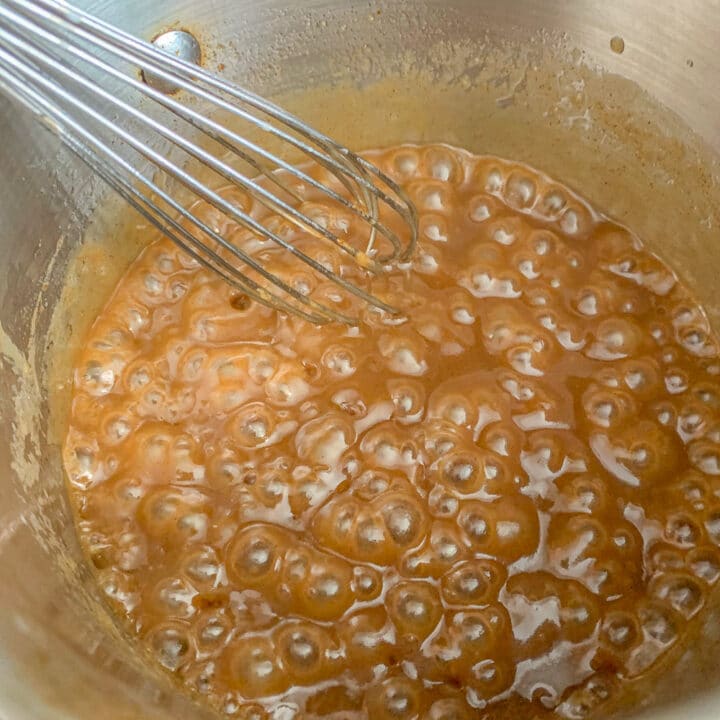 caramel in a pot being whisked