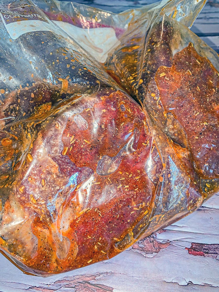 marinated steak in a ziplock bag